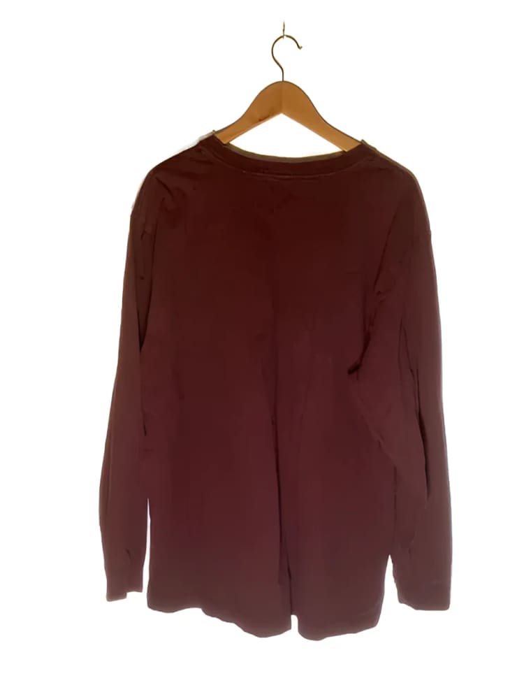 Maroon long-sleeved shirt on a hanger.