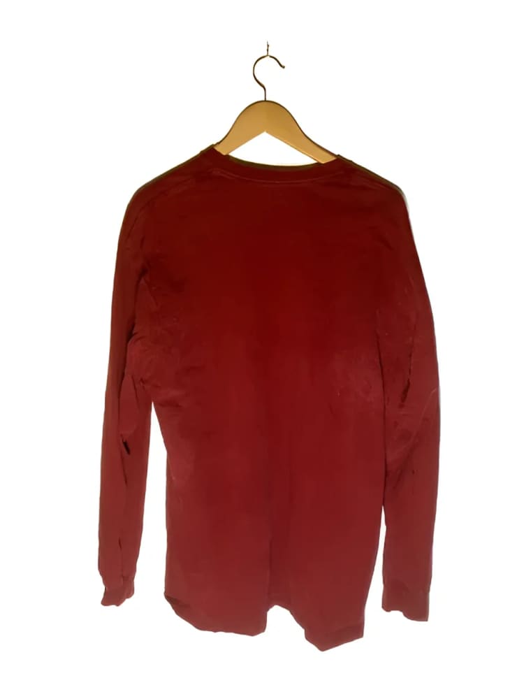 Maroon long-sleeved shirt on hanger.