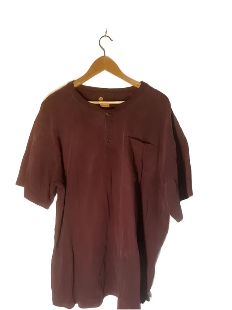 Maroon short-sleeved shirt on a hanger.
