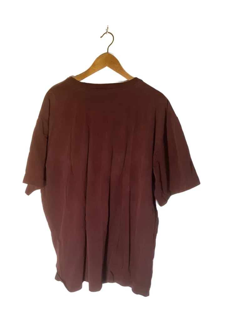 Maroon t-shirt on a hanger.