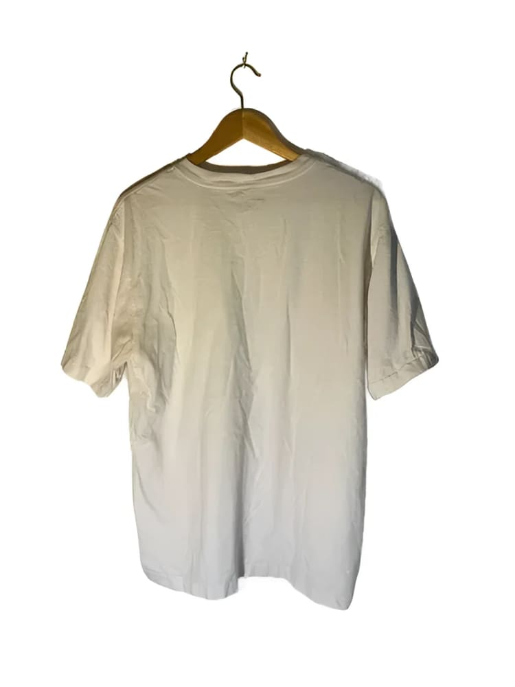 White t-shirt on a hanger.