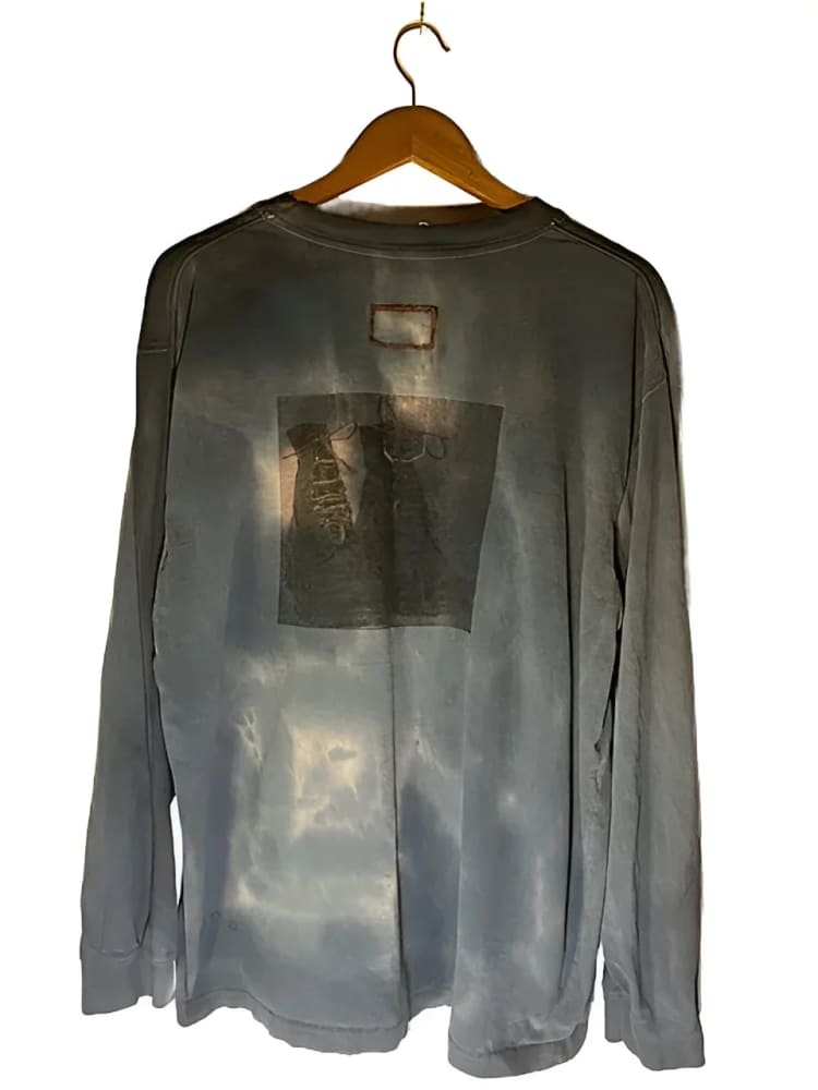Gray long-sleeved shirt on hanger.
