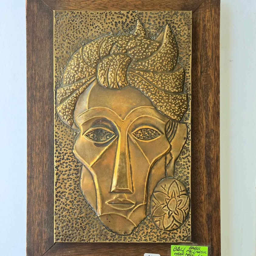 Art deco style hand hammered brass repoussé man