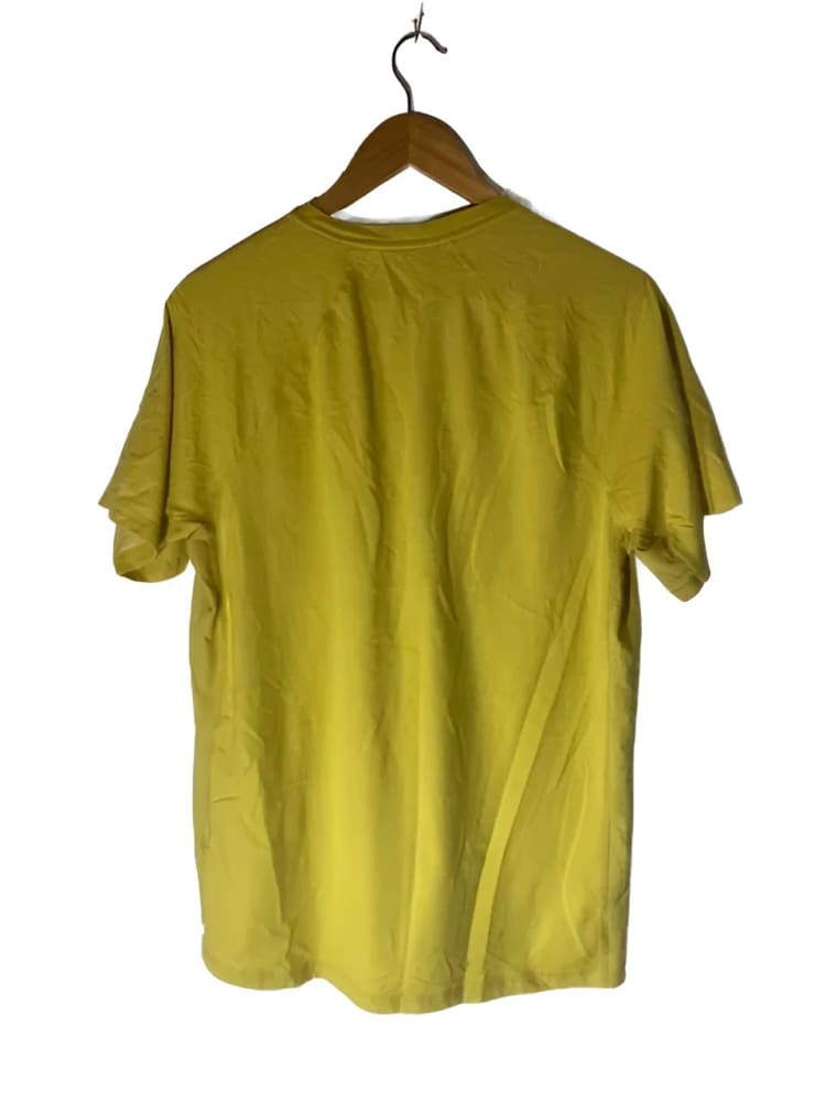 Wrinkled chartreuse short-sleeved t-shirt on a wooden hanger.