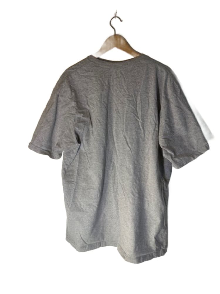 A plain grey t-shirt on a hanger.