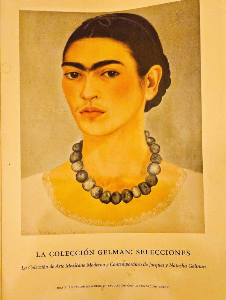 A poster for an art exhibition featuring a painting of Frida Kahlo.