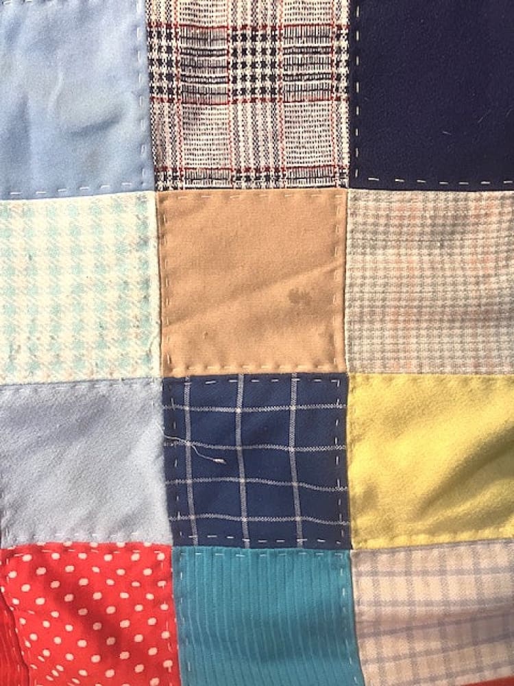 A colorful patchwork quilt made from various fabric squares.