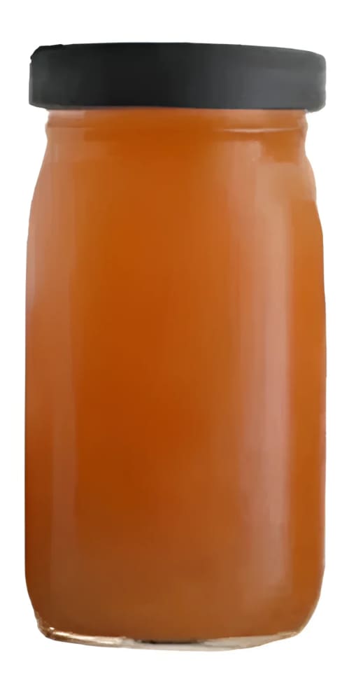 Jar of orange liquid with black lid.