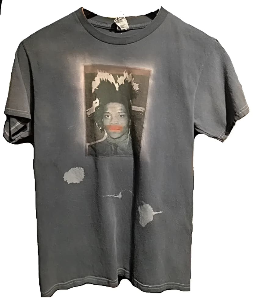 Gray t-shirt with a portrait graphic and bleach spots.