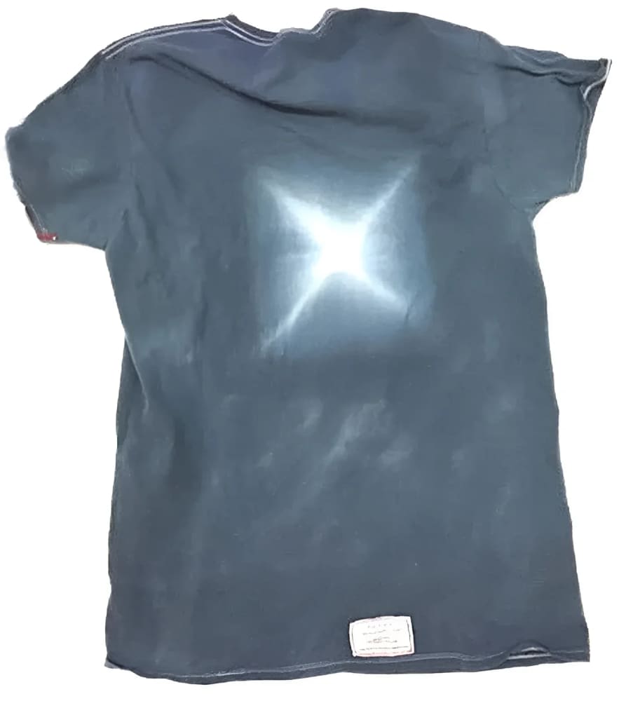 Faded blue t-shirt with a bleached star design.