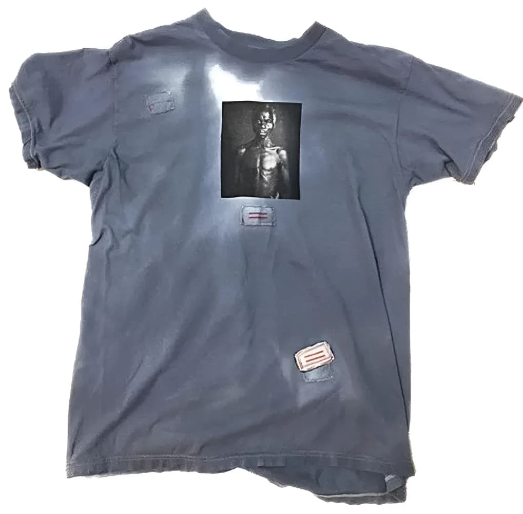 Distressed gray t-shirt with a central graphic.
