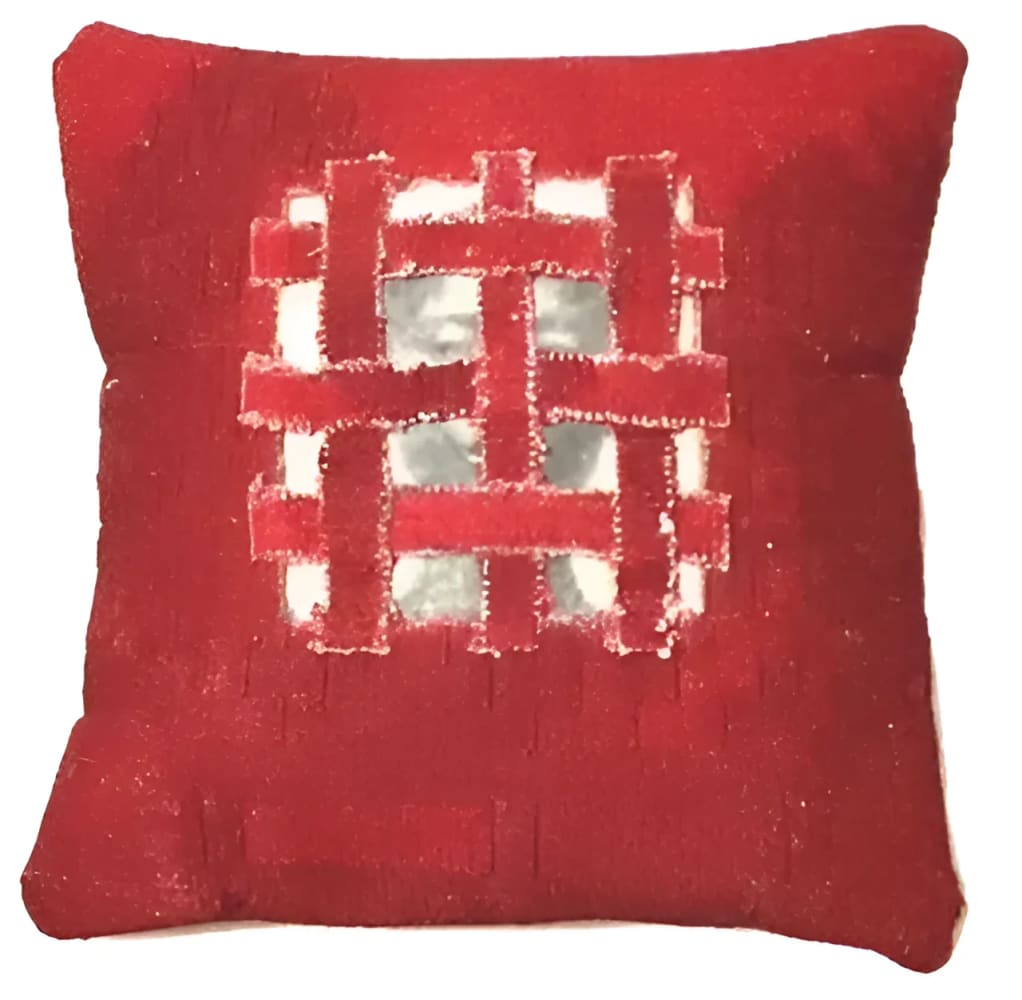 Red woven decorative pillow.