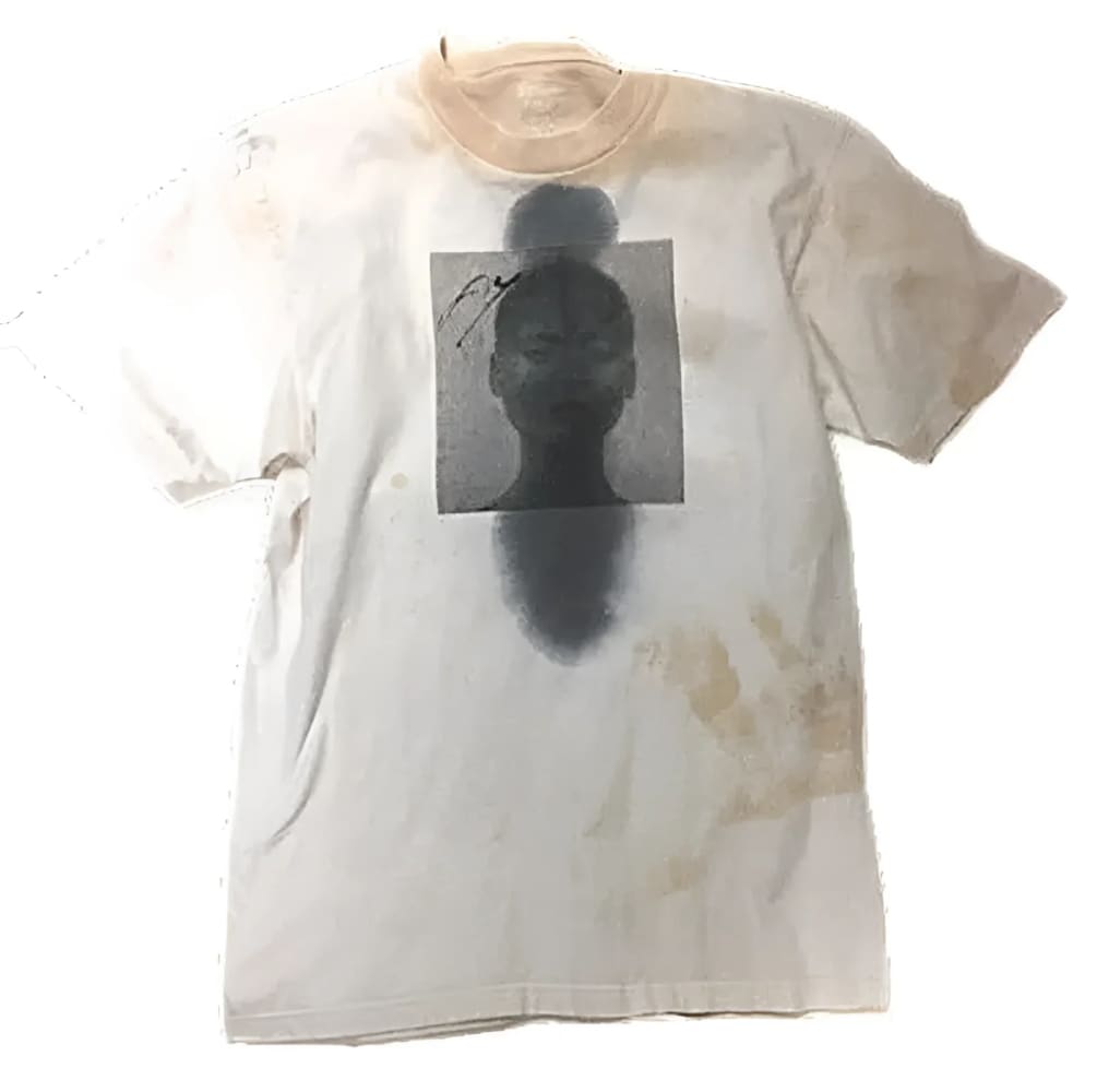 Stained white t-shirt with a black and white portrait.
