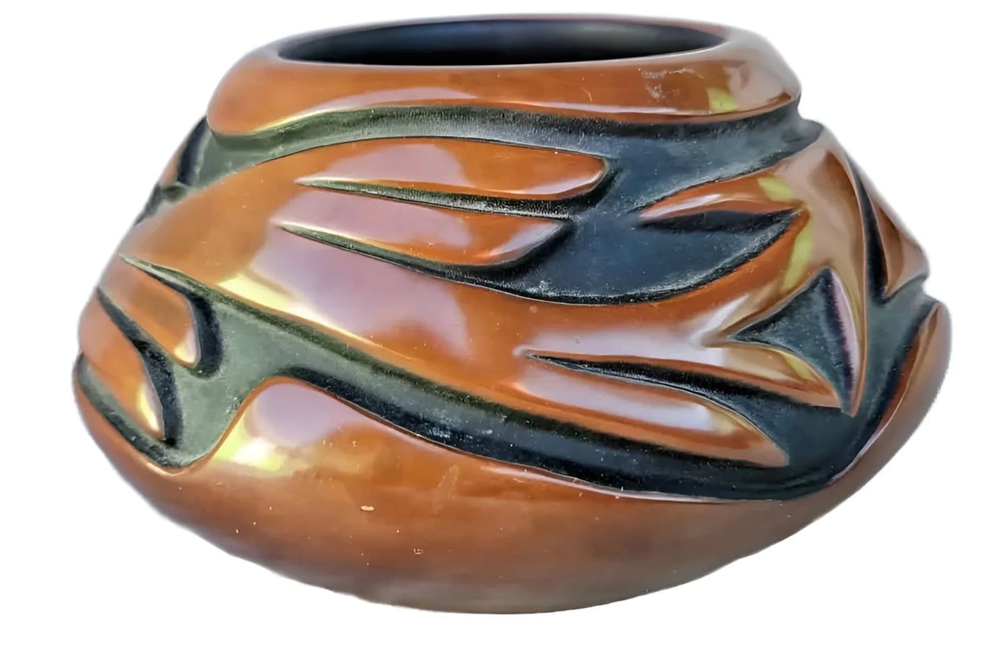 Brown and black carved ceramic pot.