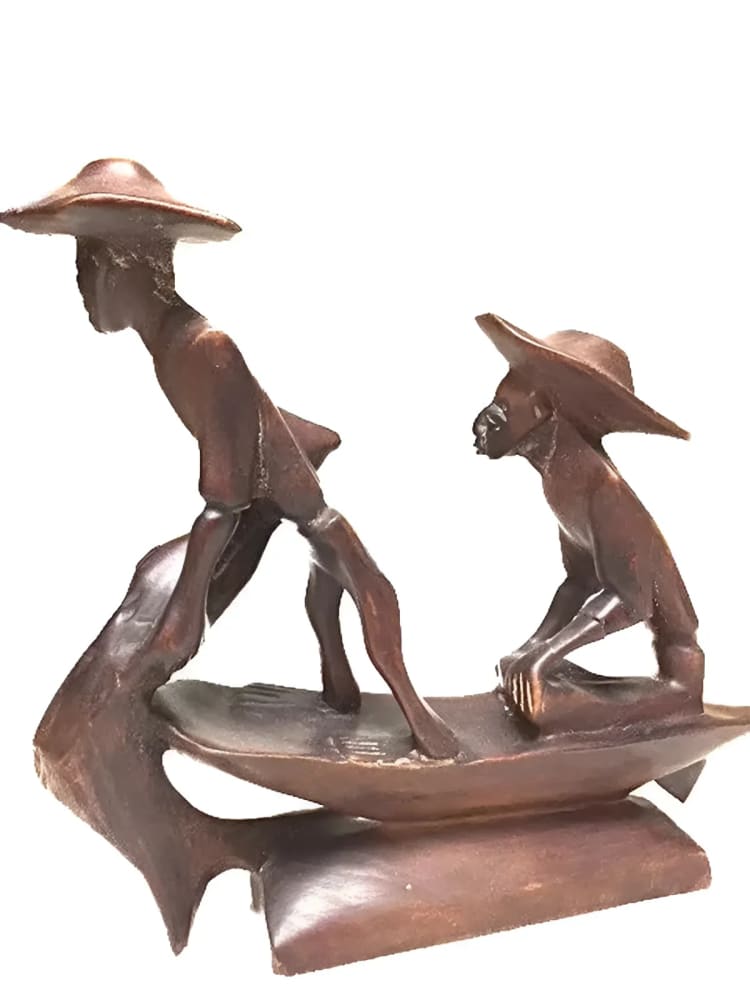 Wooden sculpture of two figures in a boat.