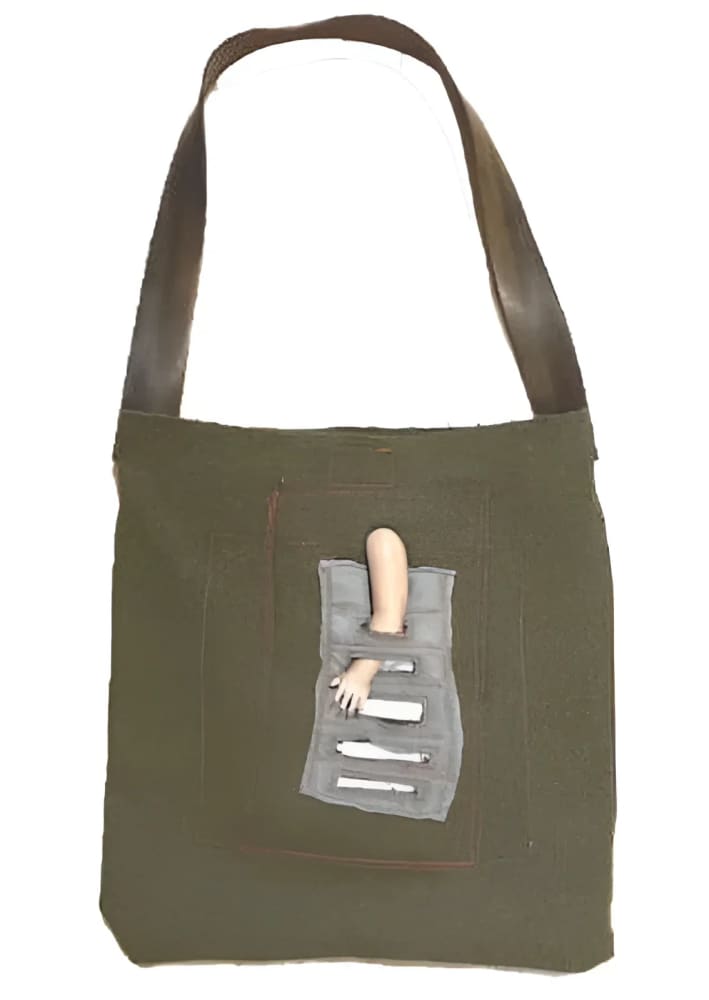 Olive green tote bag with doll arm.