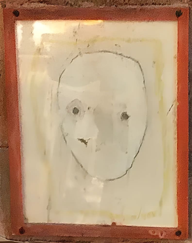 Framed, minimalist face drawing.