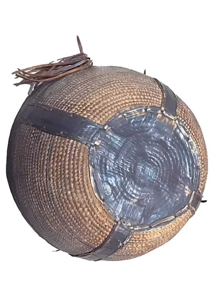 Nupe coil and leather basket from 1880s with intricate craftsmanship and leather trim