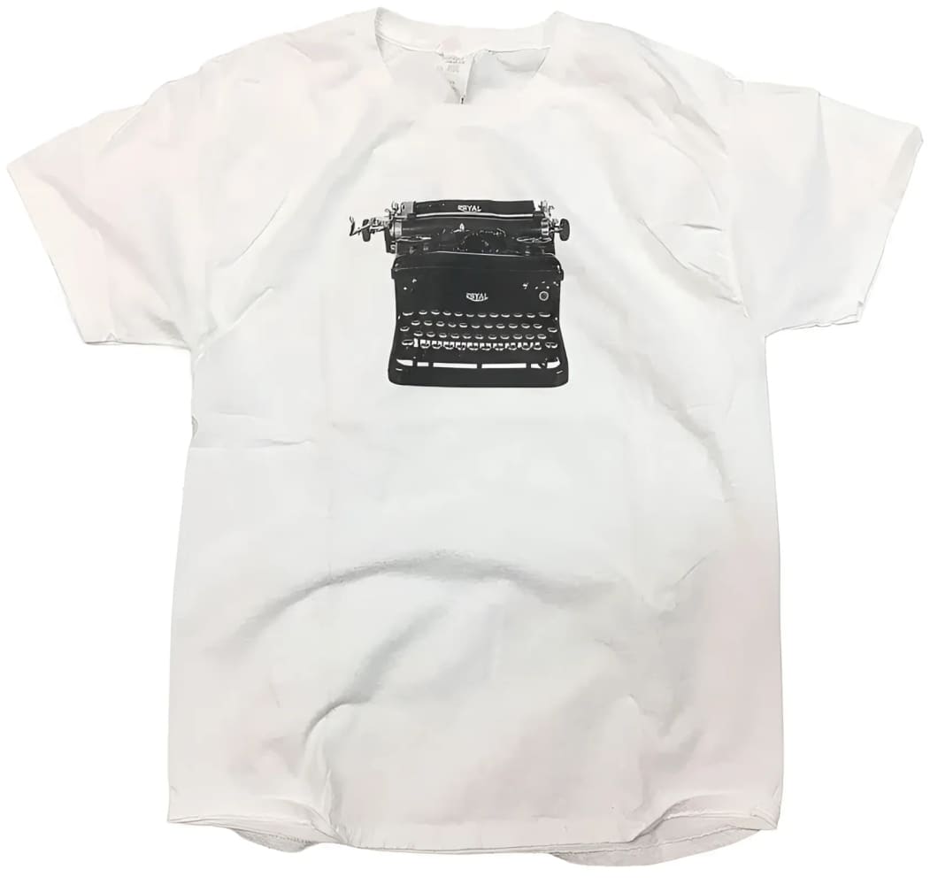 White t-shirt with typewriter graphic.