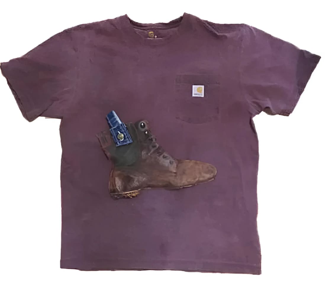 Purple Carhartt t-shirt with boot graphic.