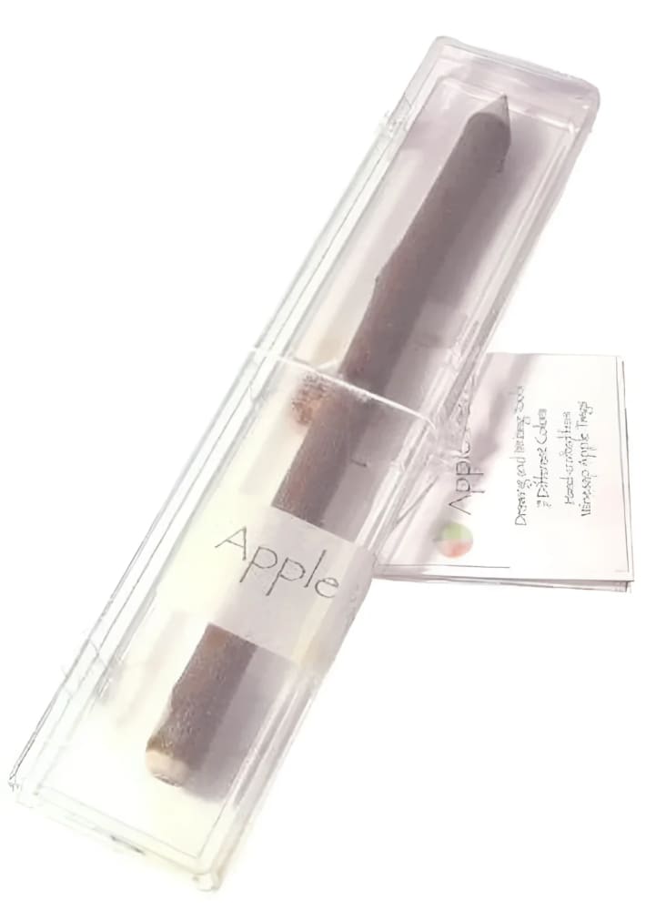 Apple-scented crayon in a clear plastic case.