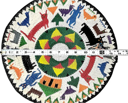 Circular Native American beaded basket with animal and geometric designs.