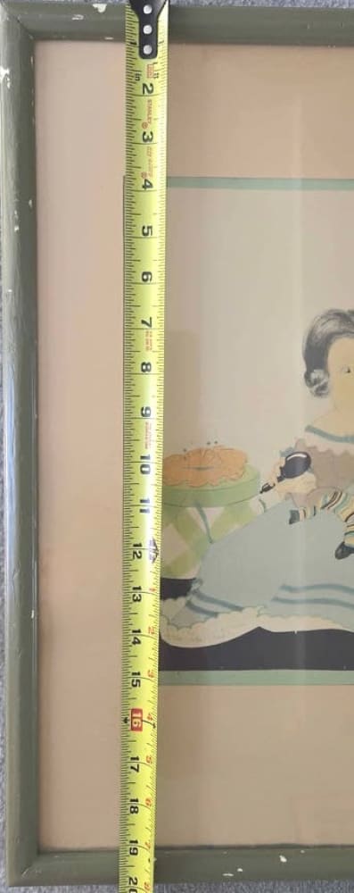 A framed picture with a measuring tape.