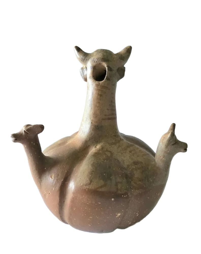 Ancient ceramic vessel with animalistic features.