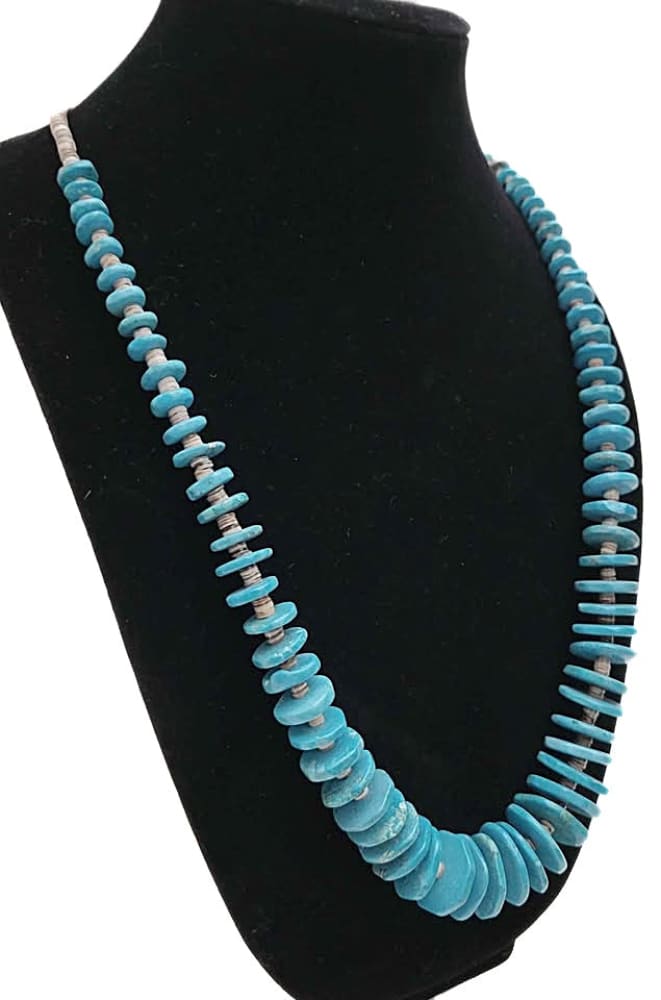 Graduated turquoise disc bead necklace.
