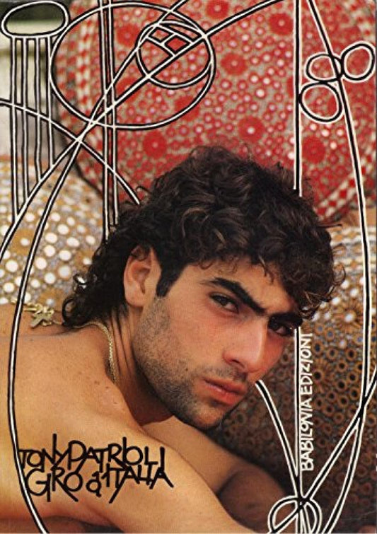 Gay erotica magazine cover featuring a shirtless man with dark, curly hair and a mustache.