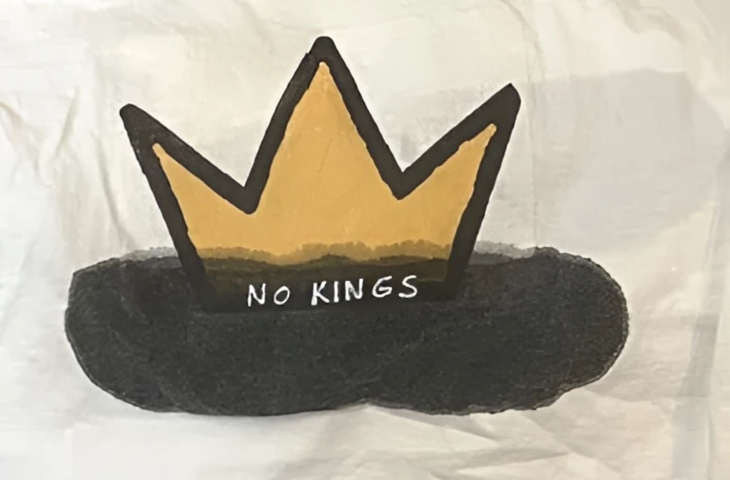 Gold crown t-shirt with black text and design.