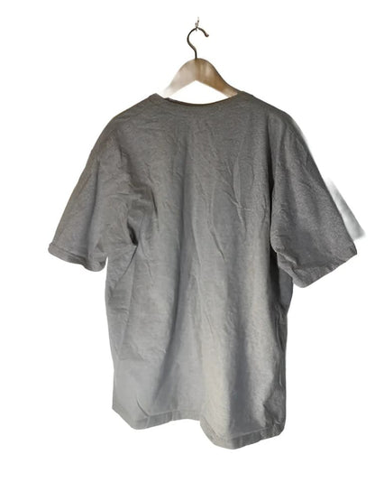 A light brown short-sleeved t-shirt on a wooden hanger.