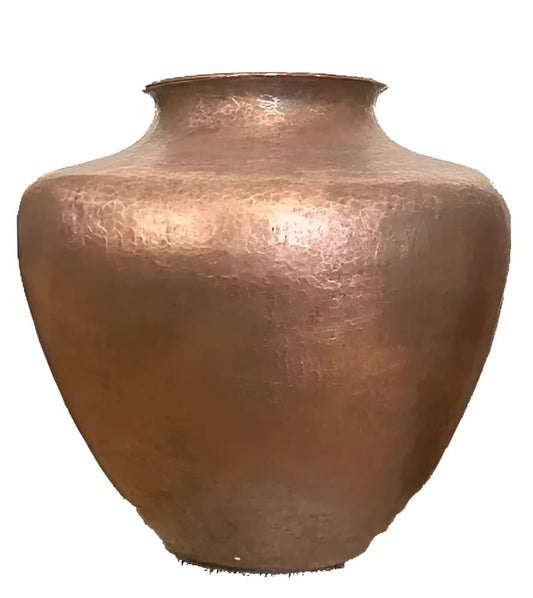 Hammered copper vase.