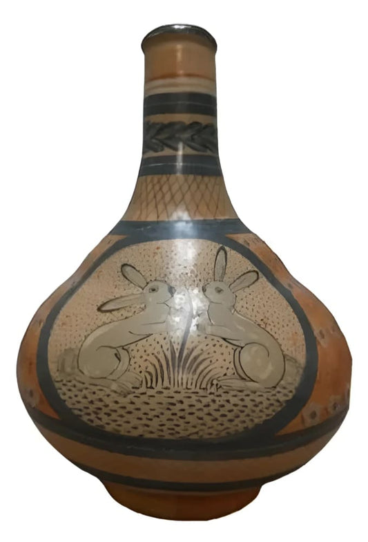 Decorated gourd vase with rabbit motif.