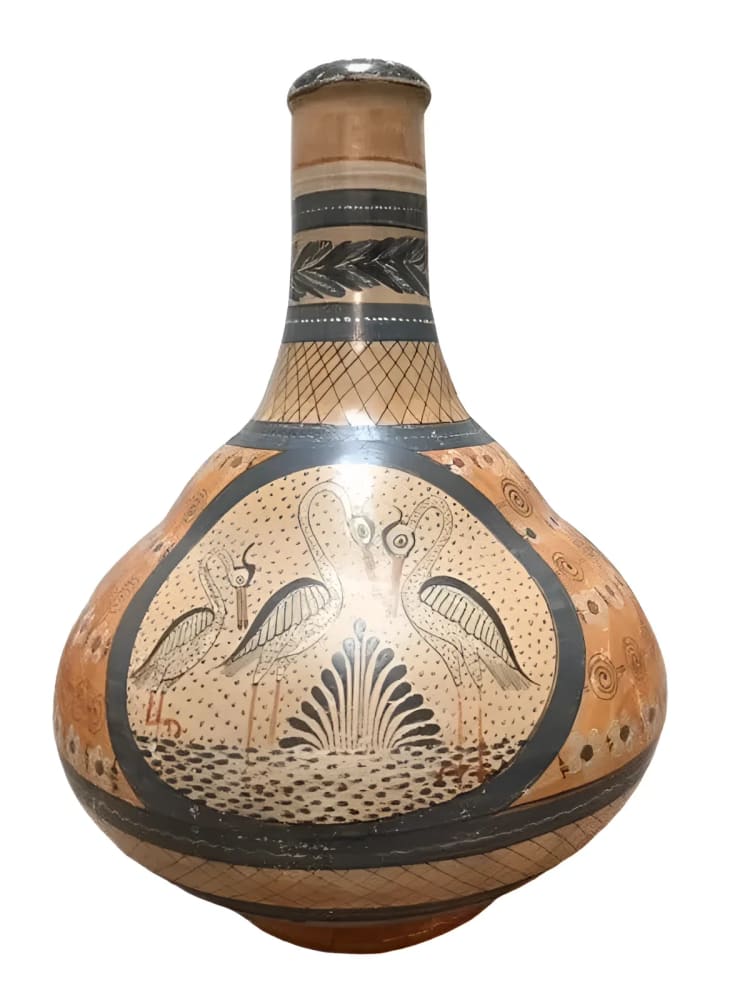 Decorated ceramic vase with bird motif.