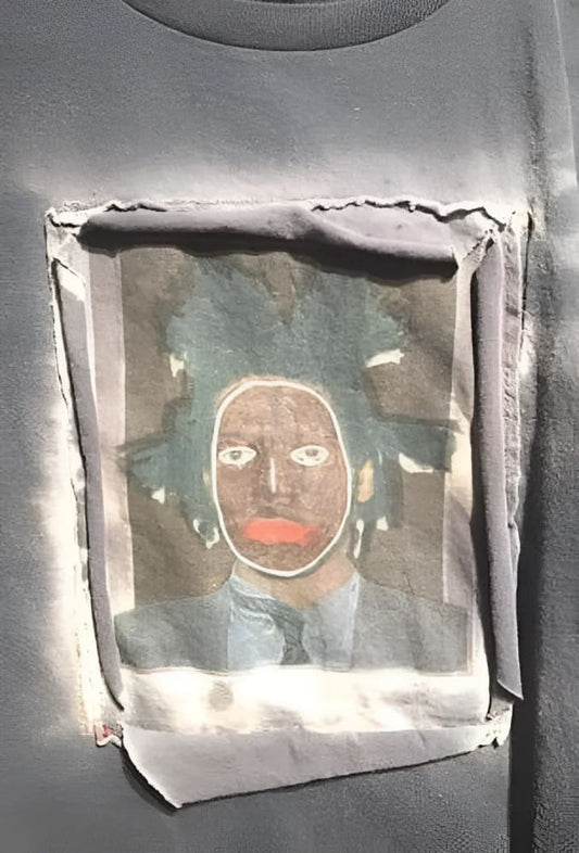 Gray t-shirt with Basquiat portrait patch.