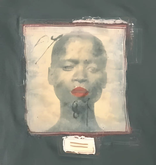 Framed portrait of a person with red lips.