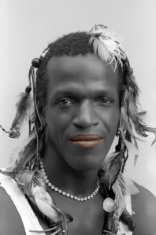 Man with feathers and beads.