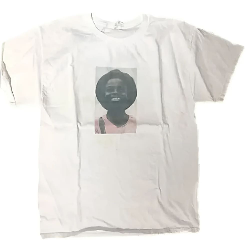White t-shirt with a portrait.