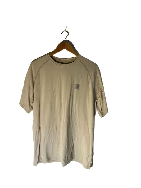 A light tan short-sleeved t-shirt with raglan seams and a small dark brown patch on the upper left chest, hanging on a wooden hanger.