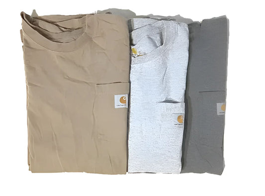 Three folded Carhartt t-shirts in tan, light gray, and dark gray.