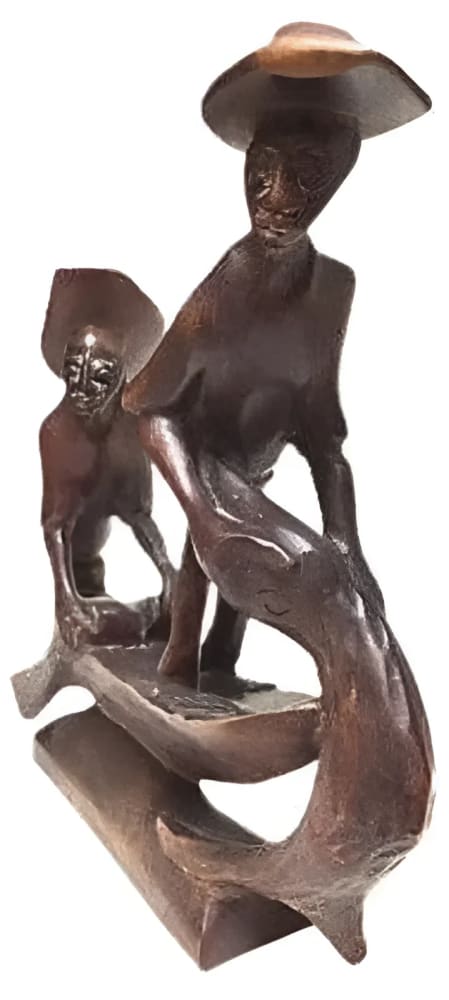 Wooden sculpture of two figures in a boat.