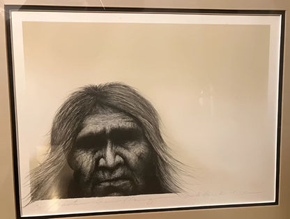 Framed portrait of an indigenous person.