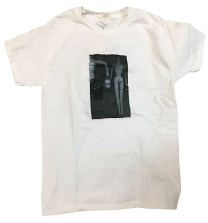 A white crewneck short-sleeved t-shirt with a black and white graphic of two dolls.