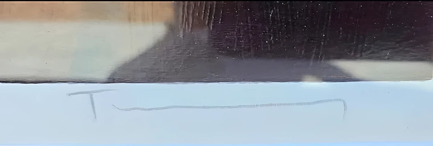 Faint signature on artwork.