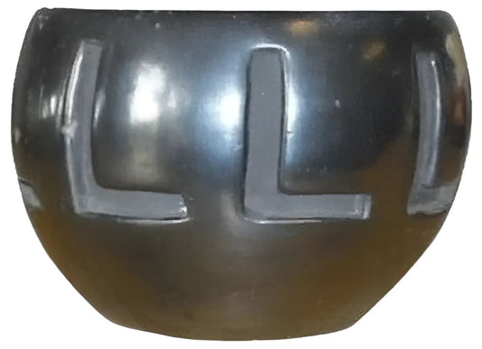 Shiny black bowl with letter L designs.