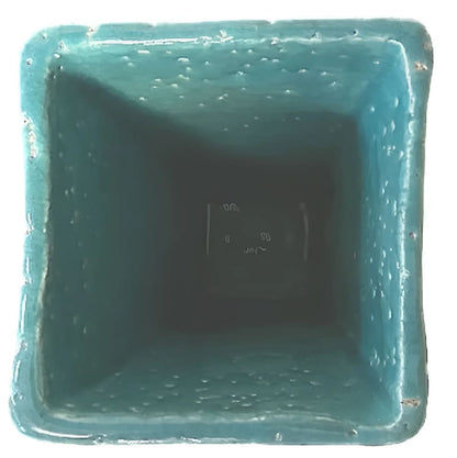 Square turquoise planter.
