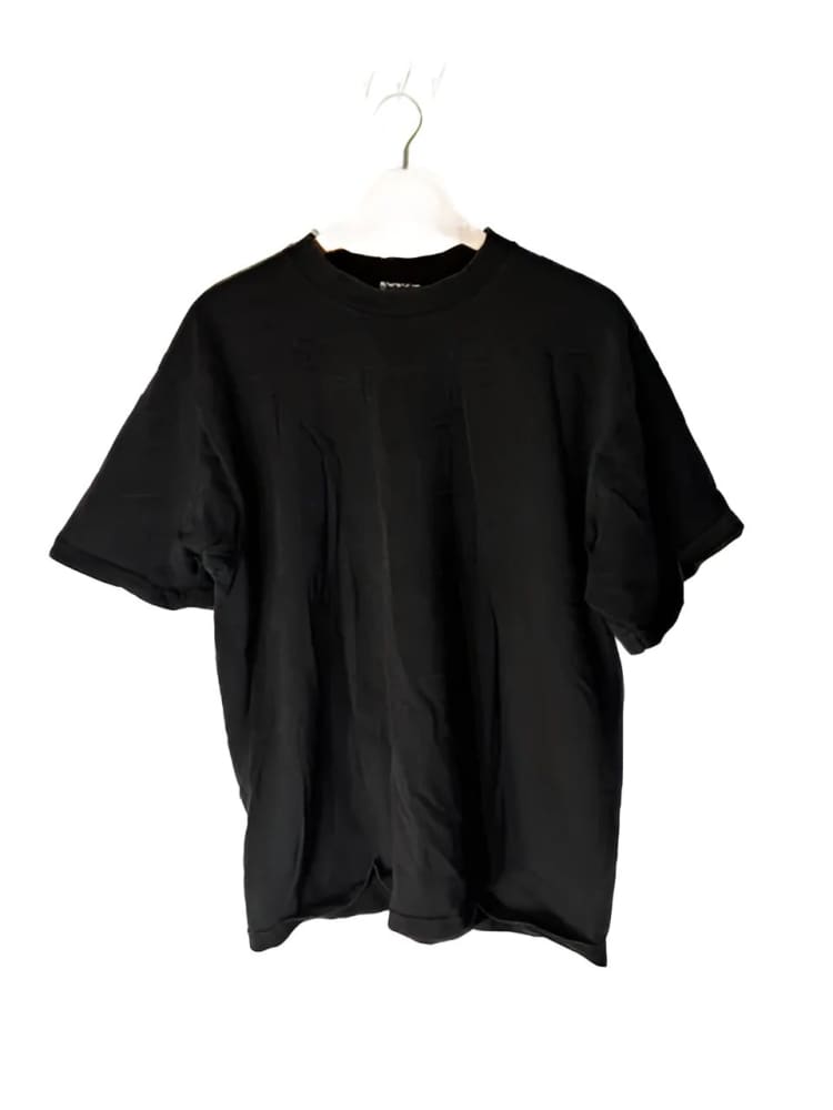 Black short-sleeved t-shirt on a hanger