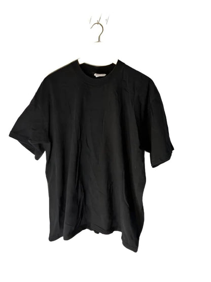 Black short-sleeved t-shirt on a hanger.