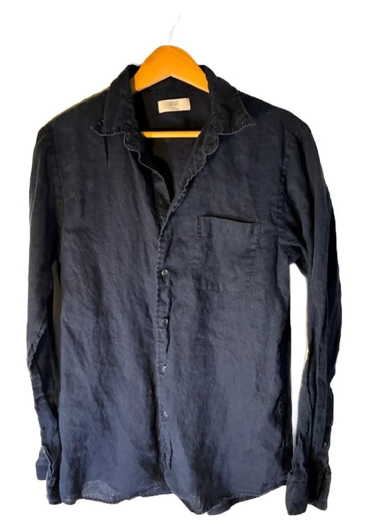 Wrinkled black long-sleeved button-up shirt with a single chest pocket.